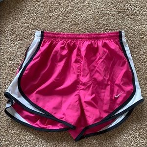 Hot pink, black, and white Nike tempo shorts
